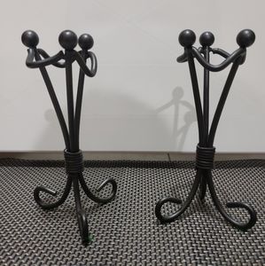 A pair of pewter candle holders